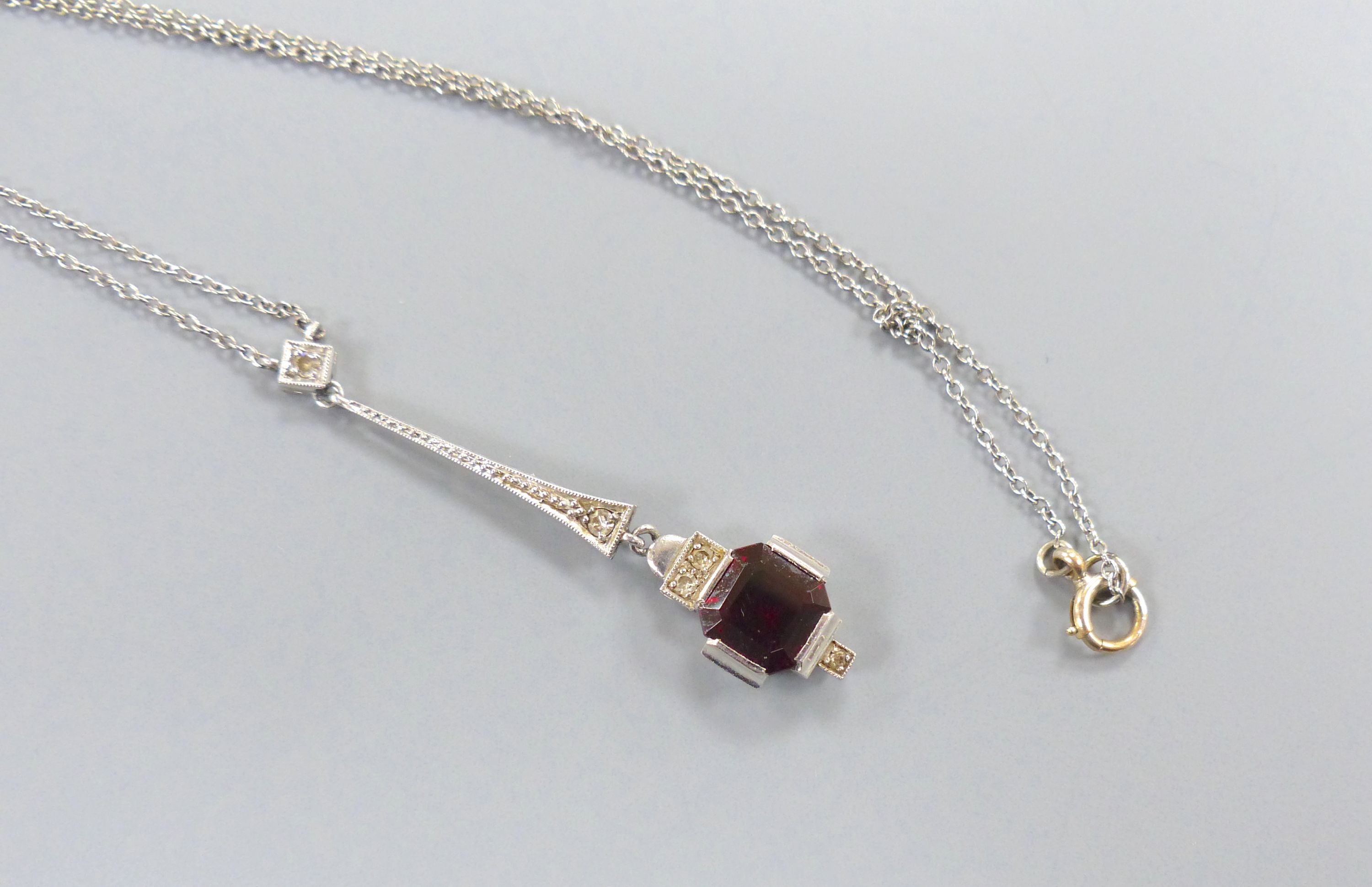 A 1920's white metal, hessonite garnet and diamond set drop pendant necklace, pendant 44mm,
